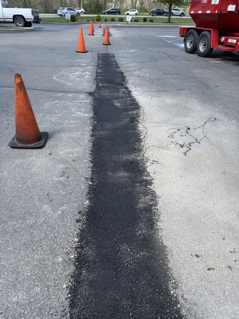 Image of a patching job done to a parking area. 