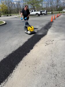 Picture Of Durakote Asphalt Services Patching a section of parking lot that was damaged. 